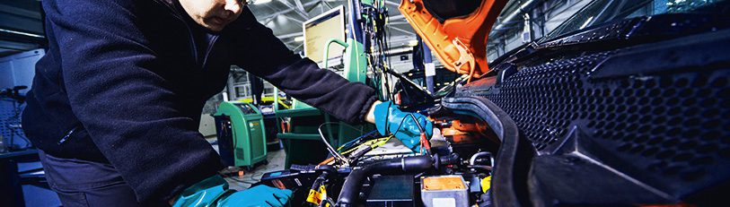 HSR-Autos-EV-and-hybrid-page-graphic-mechanic-working-on-electric-car